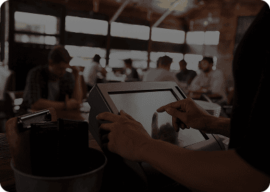 Person using touchscreen in cafe