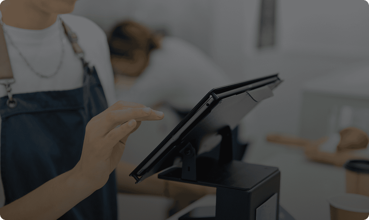 Person operating a digital checkout screen