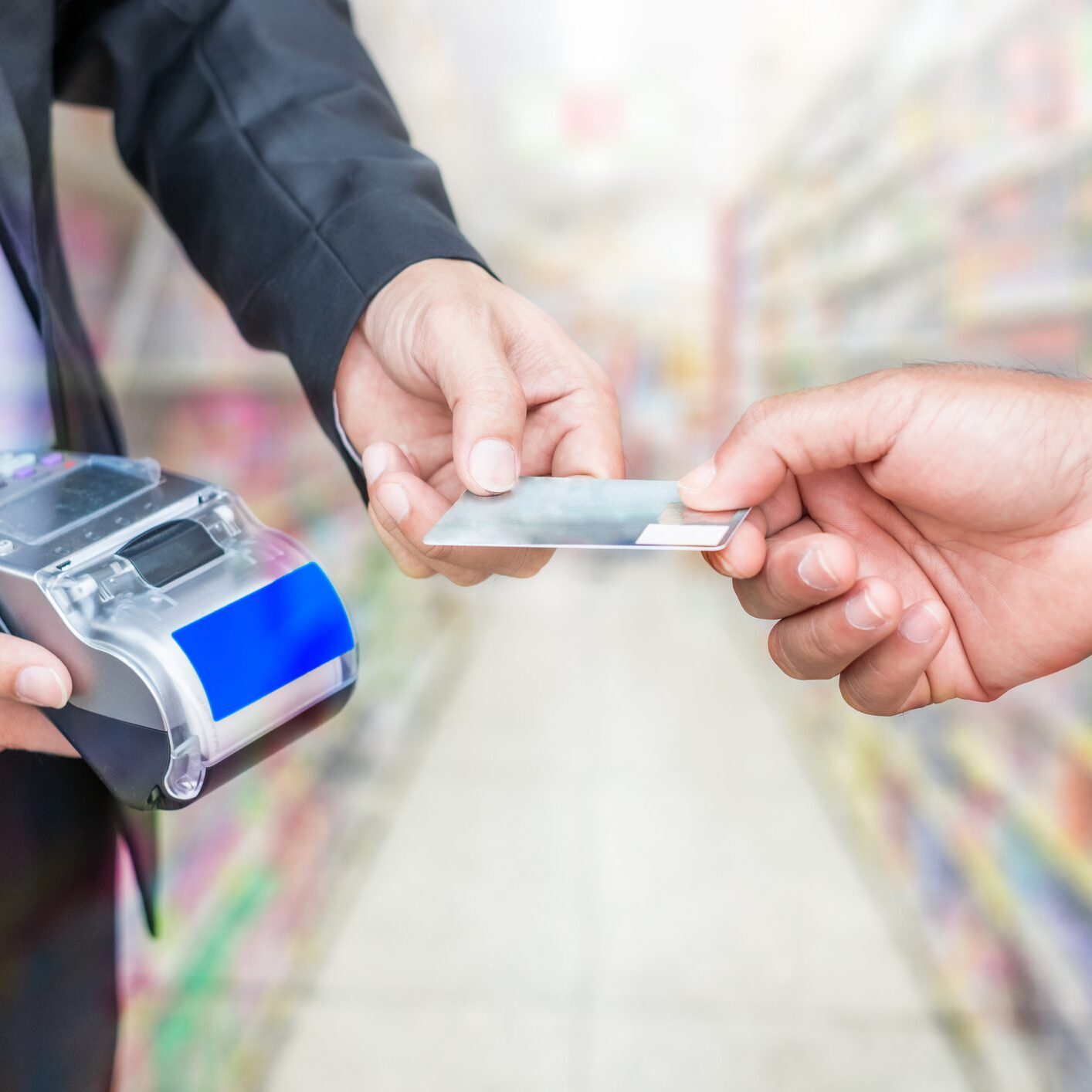 Credit card payment at store checkout counter.